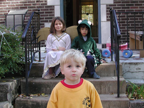 it seems clear who won the grudge match between anthony and marty over whether he would wear his costume to the neighborhood halloween party or not. you can also see how well i did in trying to get him to sit next to his brother and sister for this photo.